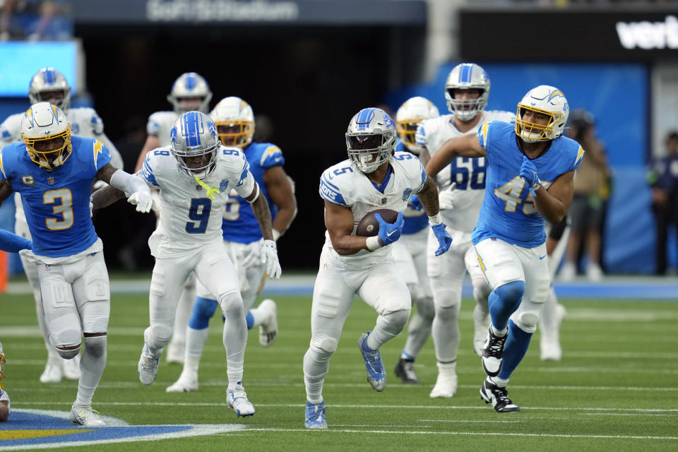 Detroit Lions running back David Montgomery (5) runs for a touchdown during the first half an NFL football game against the Los Angeles Chargers Sunday, Nov. 12, 2023, in Inglewood, Calif. (AP Photo/Ashley Landis)