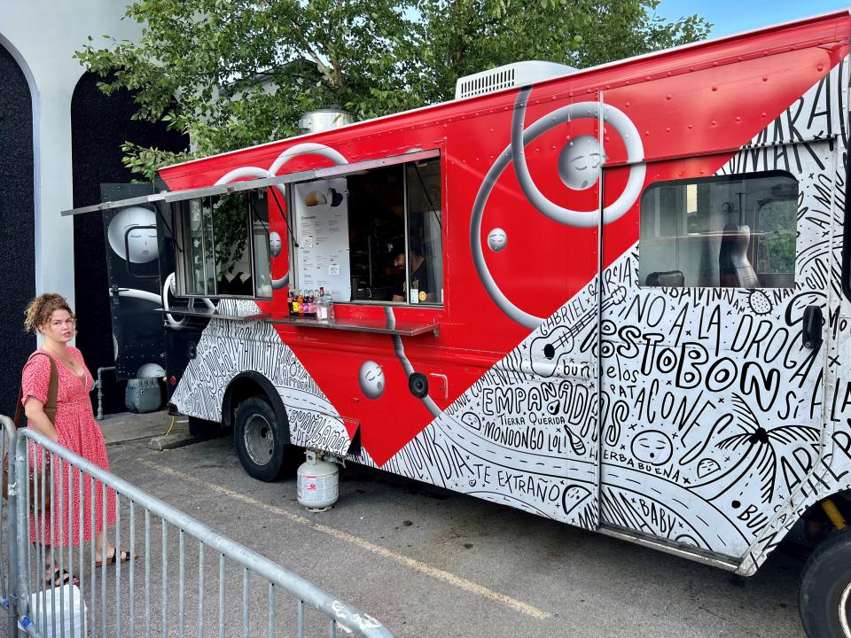 Tennessean food writer Mackensy Lunsford scowls at fellow Tennessean writer Brad Schmitt at he takes her picture outside the Chivanada food truck outside Basement East in East Nashville on July 22, 2023