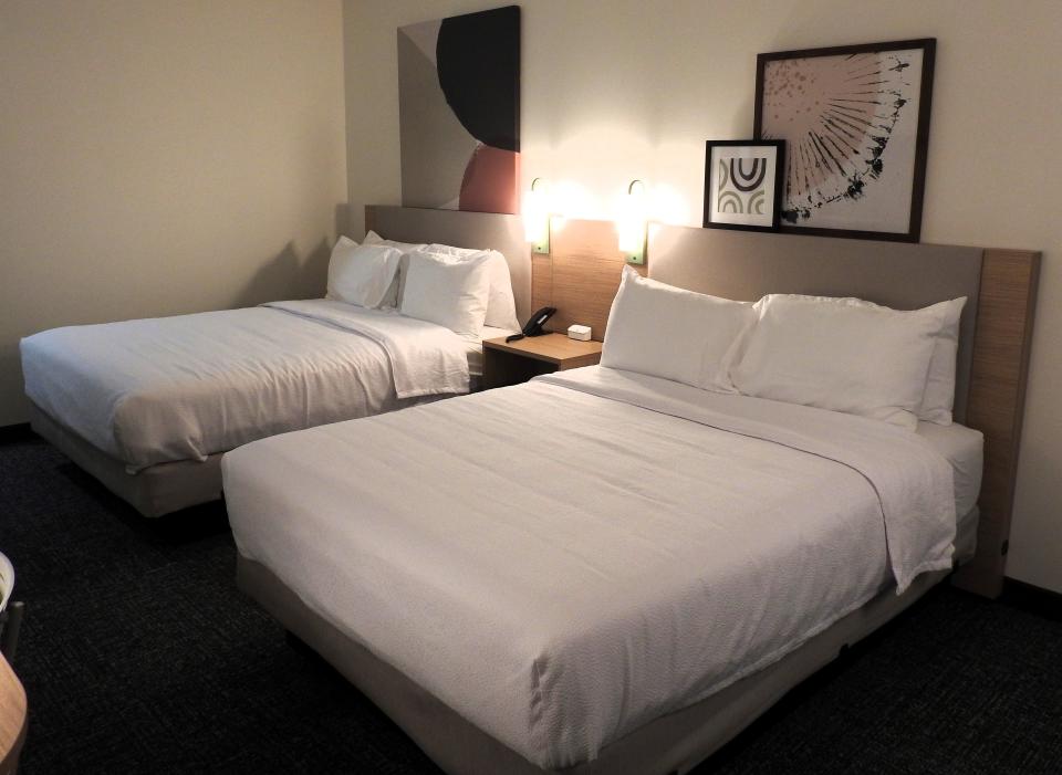 A room with two beds at the Spark by Hilton in Newcomerstown. Rooms feature streamlined furniture to make the best use of limited space in the new economy brand from the hotel giant.