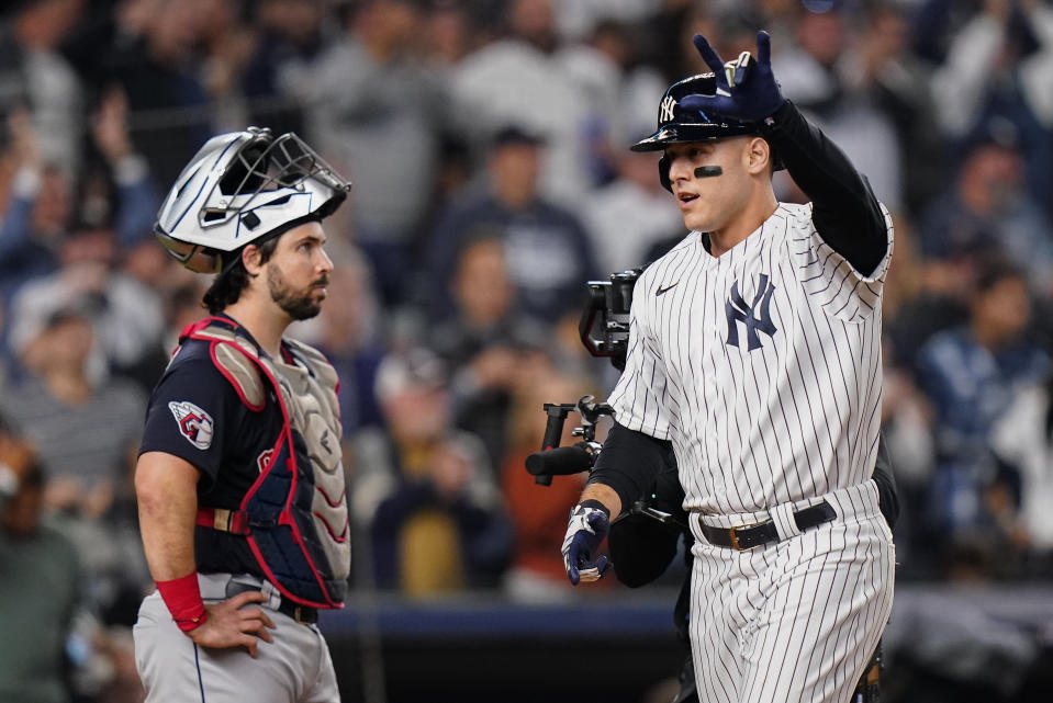 New York Yankees Anthony Rizzo reacts as he crosses home plate after hitting a two-run home run against the Cleveland Guardians during the sixth inning of Game 1 of an American League Division baseball series, Tuesday, Oct. 11, 2022, in New York. (AP Photo/Frank Franklin II)