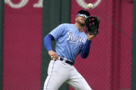 Kansas City Royals right fielder Hunter Dozier catches a fly ball for the out on Toronto Blue Jays' Bo Bichette during the first inning in the first baseball game of a doubleheader, Saturday, April 17, 2021, in Kansas City, Mo. (AP Photo/Charlie Riedel)