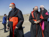 From left, Prefect of the Congregation for the Oriental Churches Cardinal Leonardo Sandri, Grand Master of the Equestrian Order of the Holy Sepulchre of Jerusalem Cardinal Fernando Filoni, and Vatican's Secretary (Relations with States) of the Secretariat of State Archbishop Paul Gallagher arrive ahead of an inter religious meeting with Pope Francis near the archaeological area of the Sumerian city-state of Ur, 20 kilometers south-west of Nasiriyah, Iraq, Saturday, March 6, 2021. Ur is considered the traditional birthplace of Abraham, the prophet common to Muslims, Christians and Jews. Earlier today Francis met privately with the country's revered Shiite leader, Grand Ayatollah Ali al-Sistani. (AP Photo/Andrew Medichini)