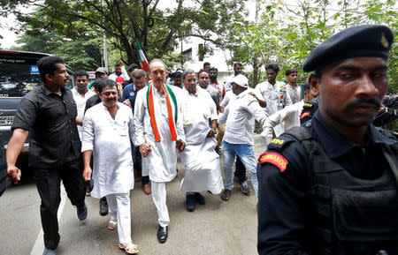 India's main opposition Congress party's leaders K. C. Venugopal (2-L), Ghulam Nabi Azad (C) and outgoing Chief Minister of the southern state of Karnataka Siddaramaiah lead a protest against India's ruling Bharatiya Janata Party (BJP) leader B.S. Yeddyurappa's swearing-in as Chief Minister of the southern state, in Bengaluru, India, May 18, 2018. REUTERS/Abhishek N. Chinnappa