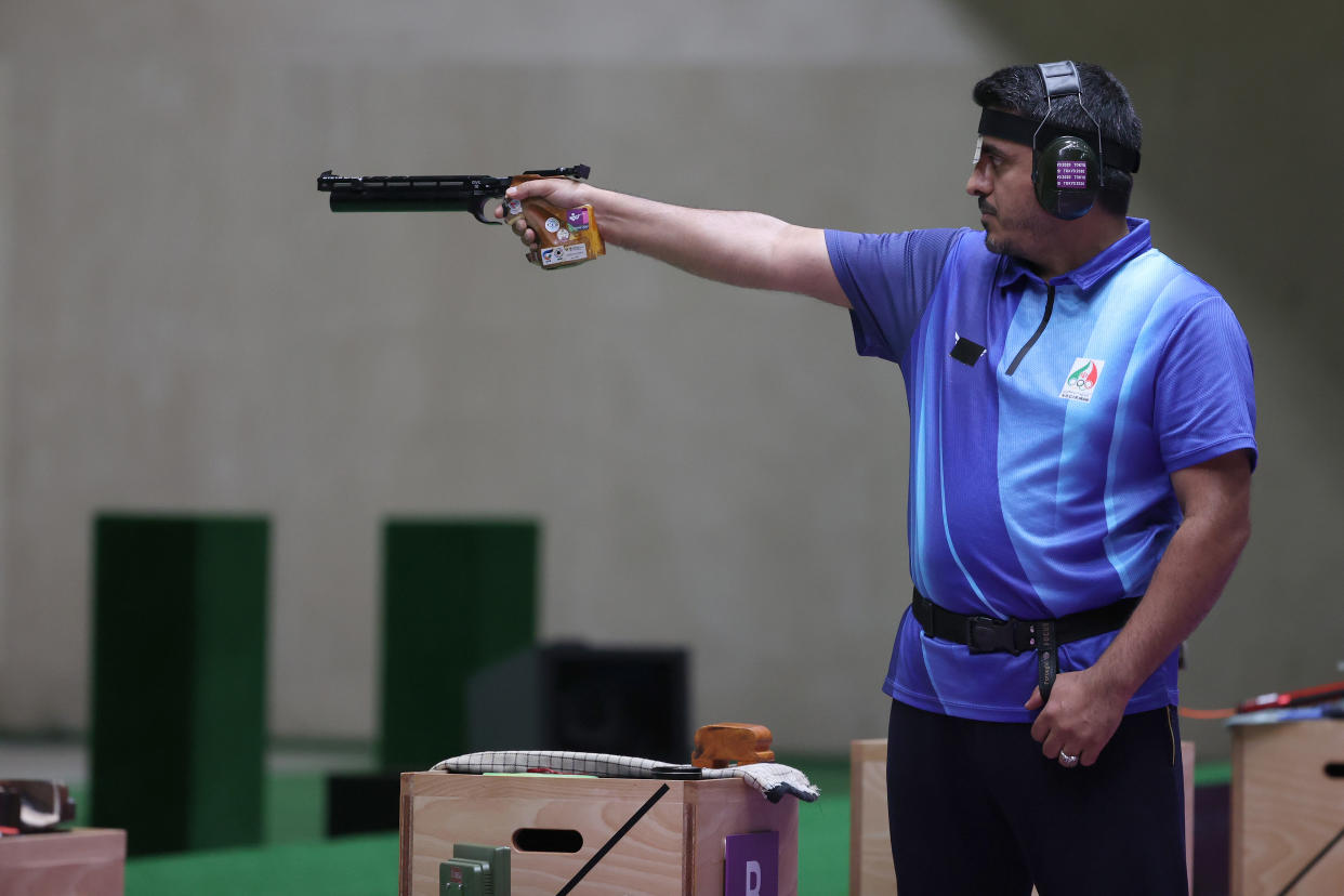 Javad Foroughi competes during finals of the 10m Air Pistol Men's event on Saturday. (Kevin C. Cox/Getty Images)