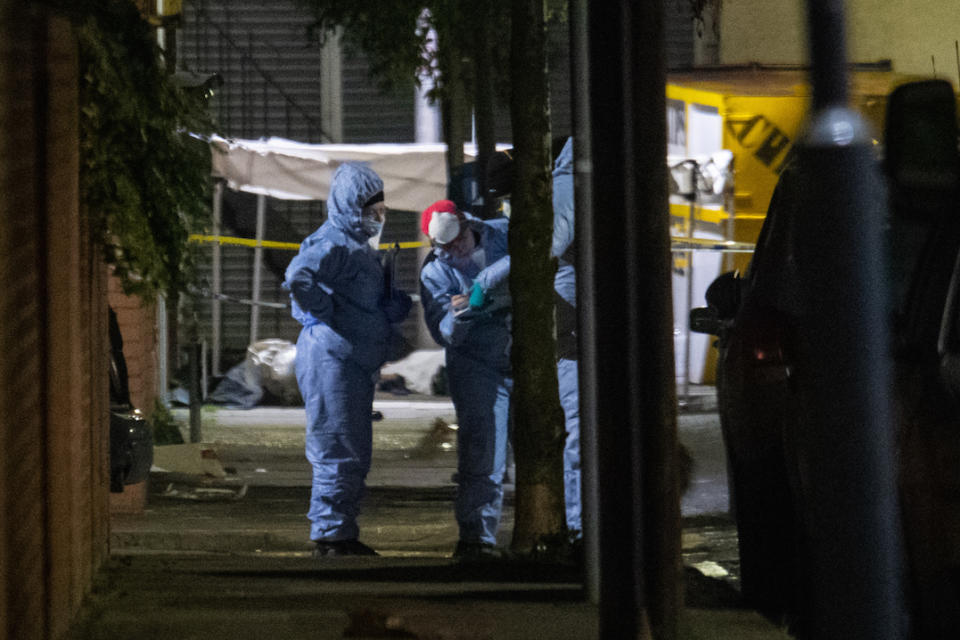 Forensics officers at the scene in Seven Kings, Ilford after a multiple stabbing.