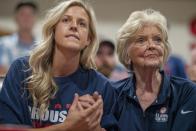 Cousin Haley Crouser, left, and grandmother Marie Crouser, right, watch with friends and family in Redmond, Ore., Wednesday, Aug. 4, 2021, as Ryan Crouser competes in the men's shot put finals at the Tokyo Olympics. (AP Photo/Nathan Howard)