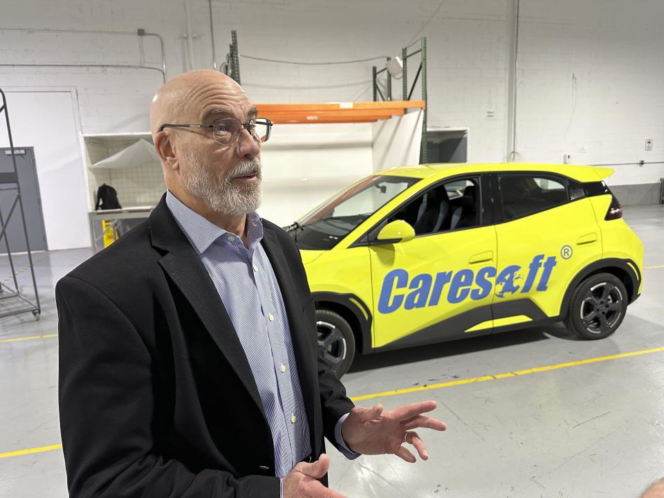 Caresoft Global President Terry Woychowski speaks to a reporter alongside a BYD Seagull electric vehicle at the Caresoft facility Wednesday, April 3, 2024, in Livonia, Mich. Woychowski, a former engineer at General Motors, said the Seagull represents a "clarion call" for the U.S. auto industry. (AP Photo/Mike Householder)