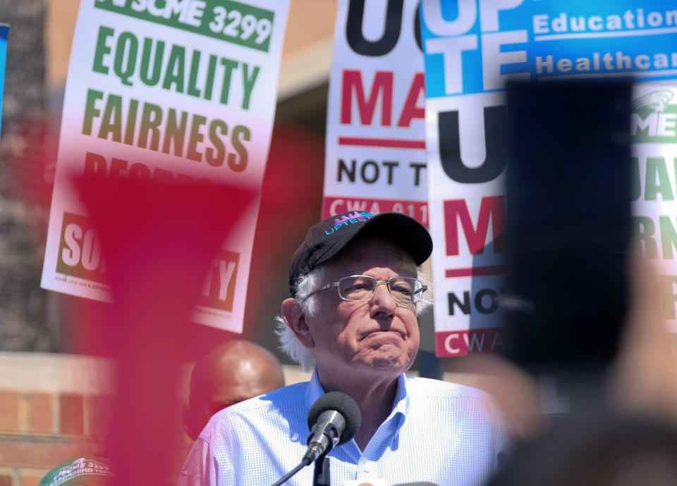 FILE - In this March 20, 2019 file photo, Vermont Sen. Bernie Sanders talks to striking workers at a rally at the University of California Los Angeles,Members of a union representing research and technical workers walked picket lines Wednesday at University of California campuses and hospitals in a one-day strike amid a lengthening stretch of unsuccessful contract negotiations. (AP Photo/Richard Vogel)