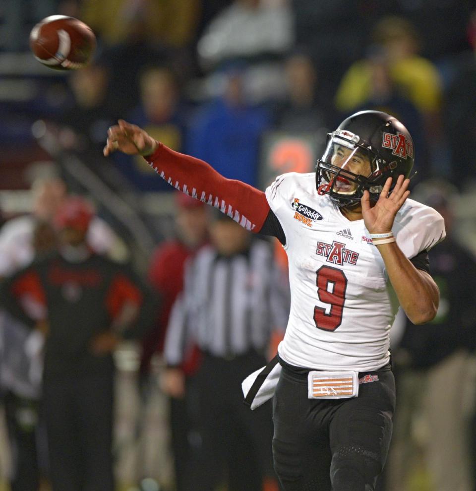 Arkansas State quarterback Fredi Knighten (9) passes against Ball State in the fourth quarter of the GoDaddy Bowl NCAA college football game in Mobile, Ala., Sunday, Jan. 5, 2014. Arkansas State defeated Ball State, 23-20. (AP Photo/G.M. Andrews)