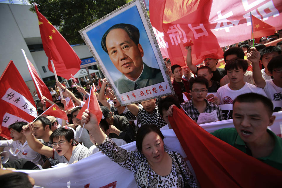 FILE - Anti-Japan protesters on disputed islands march near the Japanese Consulate General in Shanghai, China, on Sept. 16, 2012. Japan and China on Thursday, Sept. 29, 2022, mark the 50th anniversary of the 1972 normalization of their ties, but there isn't much of a celebratory mood. (AP Photo/Eugene Hoshiko, File)