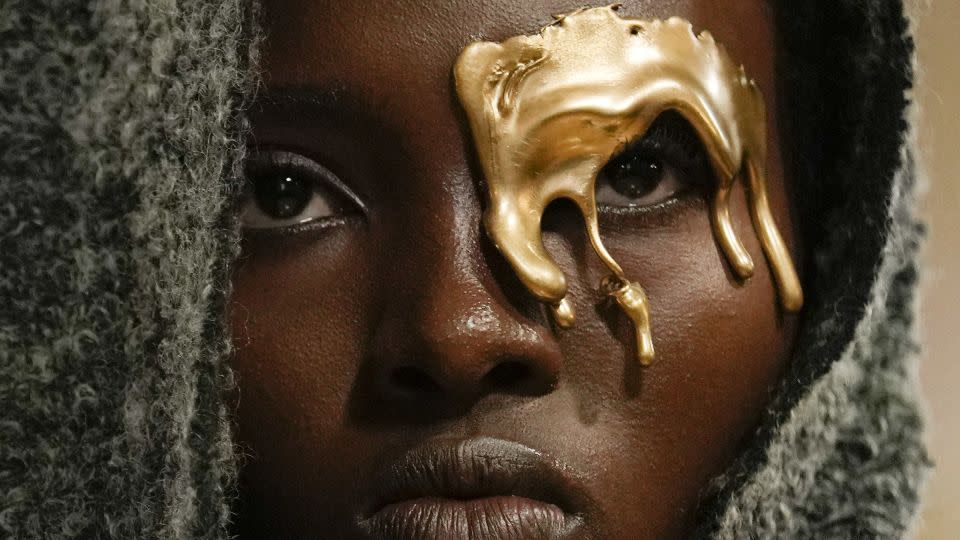 The inventive collection also featured this golden face adornment. - Antonio Calanni/AP