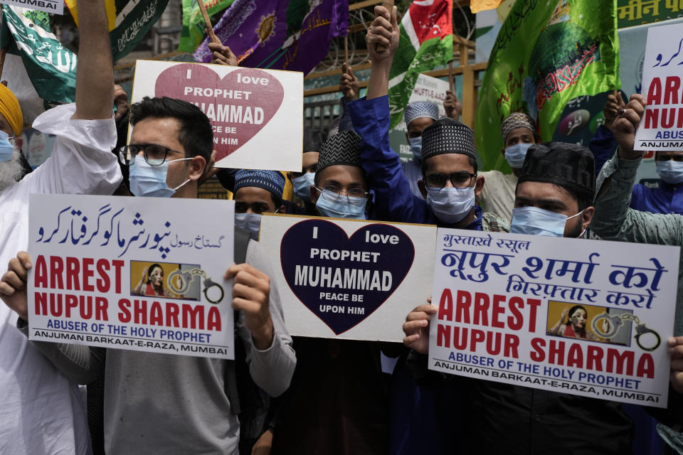 Indian Muslims hold placards demanding the arrest of Nupur Sharma, a spokesperson of governing Hindu nationalist party as they react to the derogatory references to Islam and the Prophet Muhammad made by her during a protest in Mumbai, India, Monday, June 6, 2022. At least five Arab nations have lodged official protests against India, and Pakistan and Afghanistan also reacted strongly Monday to the comments made by two prominent spokespeople from Prime Minister Narendra Modi's Bharatiya Janata Party. (AP Photo/Rafiq Maqbool)