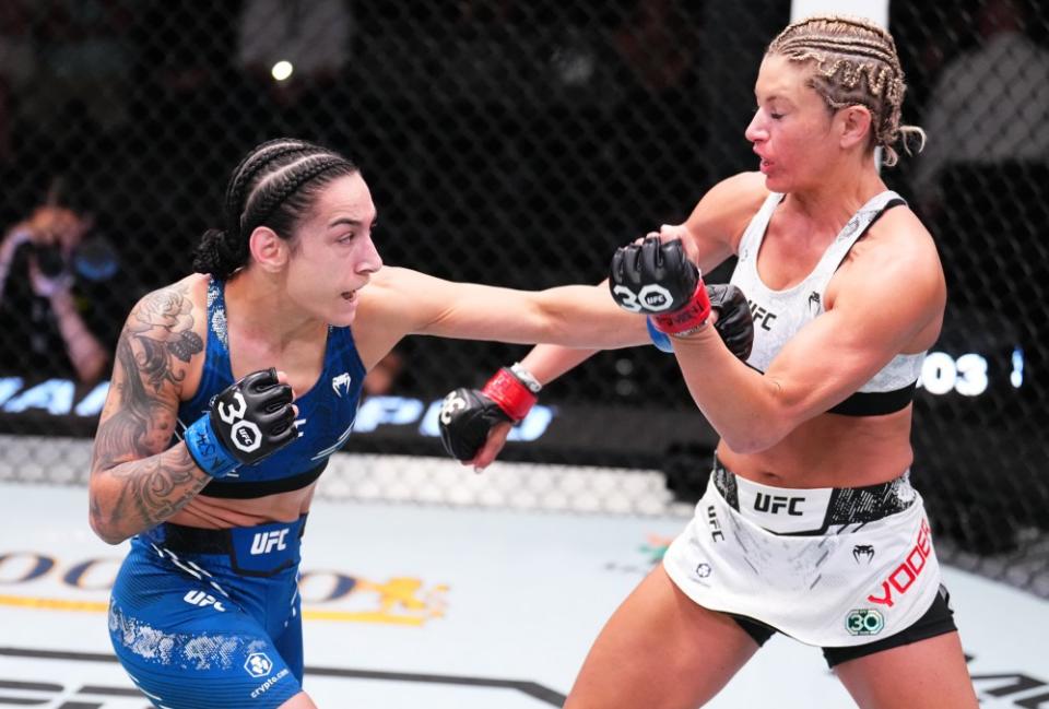 LAS VEGAS, NEVADA – OCTOBER 14: (L-R) Emily Ducote punches Ashley Yoder in a strawweight fight during the UFC Fight Night event at UFC APEX on October 14, 2023 in Las Vegas, Nevada. (Photo by Chris Unger/Zuffa LLC via Getty Images)