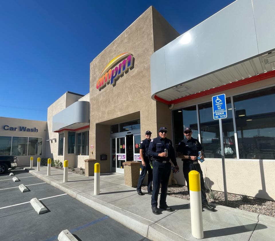 Victorville Fire Department personnel at the new AMPM convenience store now open on uptown Seventh Street.