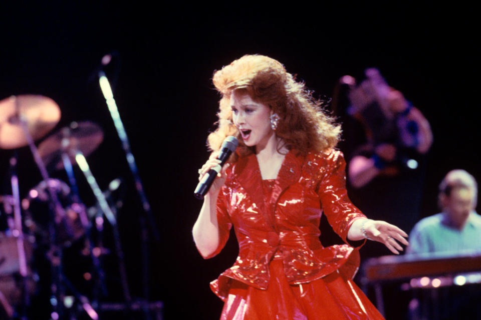 In 1988, Naomi Judd performs with the Judds at Madison Square Garden in New York City. (Photo: Ebet Roberts/Getty Images)