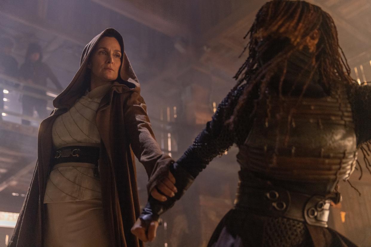 Jedi Master Indara (Carrie-Anne Moss) tussles with the mysterious warrior Mae (Amandla Stenberg) in the new "Star Wars" Disney+ series "The Acolyte."