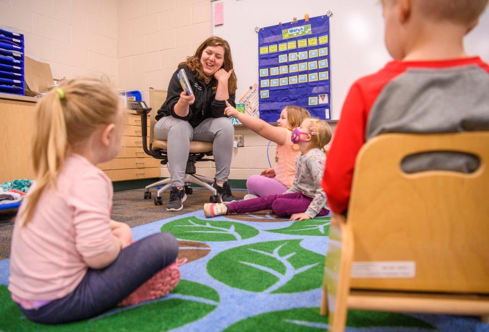 Amber Harrison reads a book and counts with her class March 22 at the new Edgewood Early Childhood Center in Ellettsville.