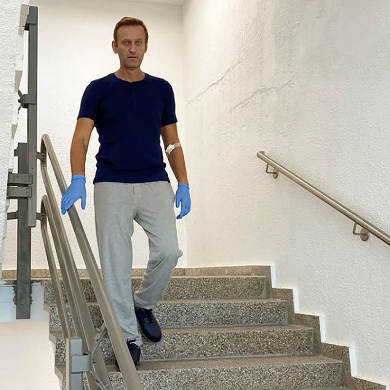 Russian opposition politician Alexei Navalny goes downstairs at Charite hospital in Berlin
