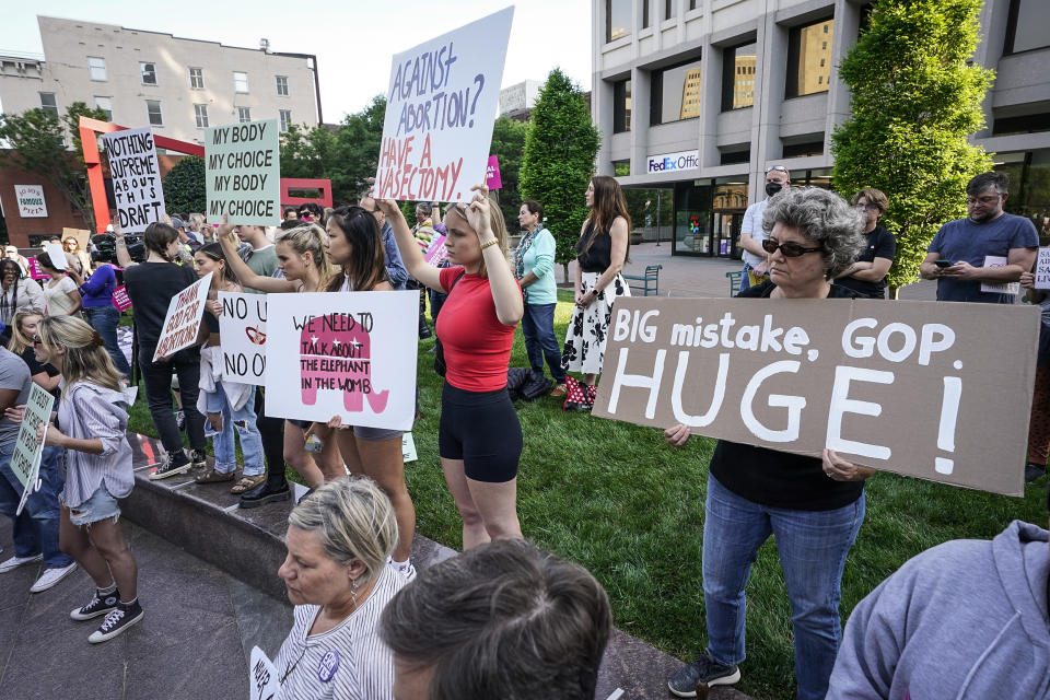 Image: Protesters carry signs and listen to speakers as they demonstrate near a federal court on May 3, 2022, in Richmond, Va. (Steve Helber / AP)