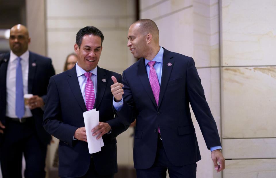 House Democratic Caucus Chair Hakeem Jeffries, D-N.Y., center, and and Vice Chair Rep. Pete Aguilar, D-Calif., left, arrive to speak to reporters after a meeting with Biden administration officials to discuss progress on an infrastructure bill, at the Capitol in Washington, Tuesday, June 15, 2021. (AP Photo/J. Scott Applewhite)