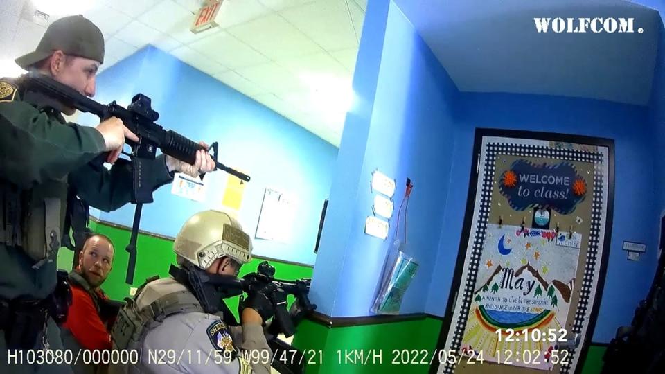 Bodycam shows law enforcement officers inside the hallway more than 30 minutes after the shooting began (via REUTERS)