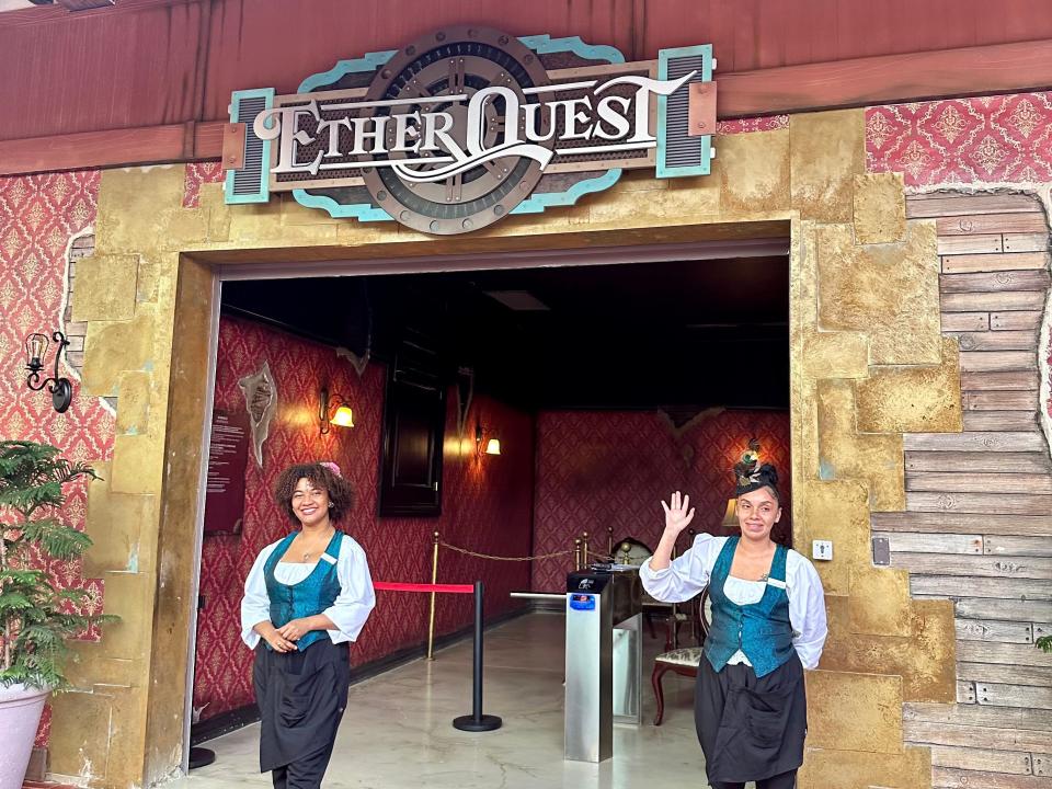 Etherquest entrance with two employees in front