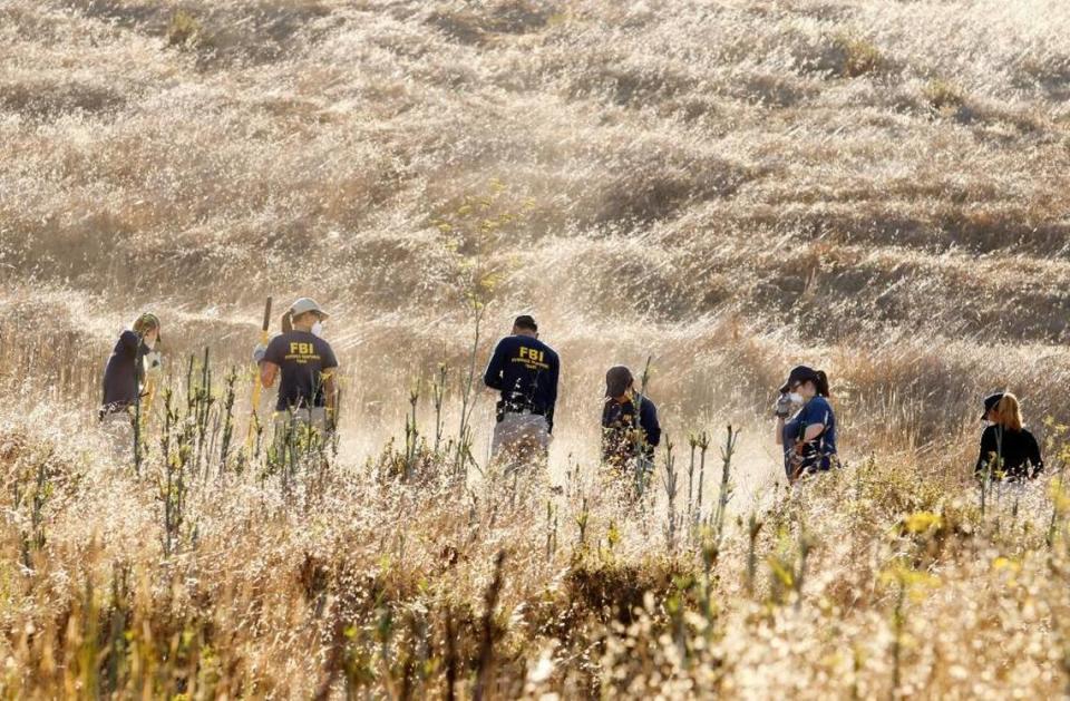 FBI and Sheriff’s Office investigators look for the remains of missing Cal Poly student Kristin Smart on a campus hillside in 2016.