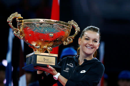 FILE PHOTO: Tennis - China Open women's final - Beijing, China - 09/10/16. Poland's Agnieszka Radwanska holds the trophy after defeating Britain's Johanna Konta. REUTERS/Thomas Peter/File Photo