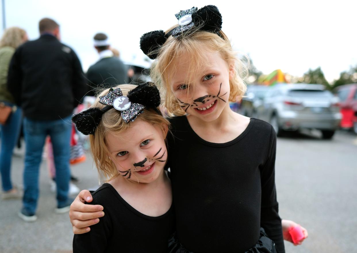 Sisters Collette Lippert, 4, and Madeline Lippert, 6, dress as cats during the Fall Festival of Treats on Wednesday at St. Luke's United Methodist Church-Edmond.