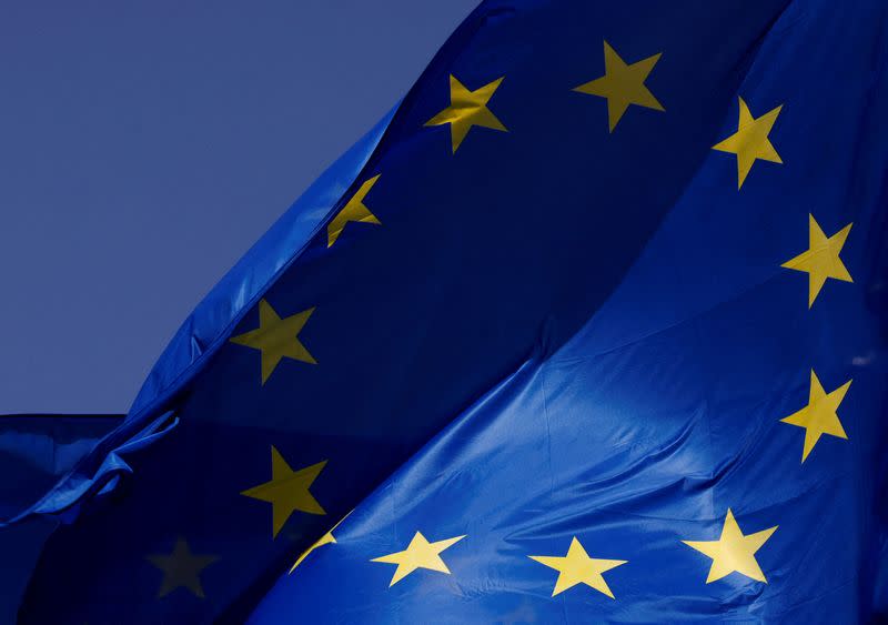 FILE PHOTO: European Union flags flutter outside the EU Commission headquarters in Brussels