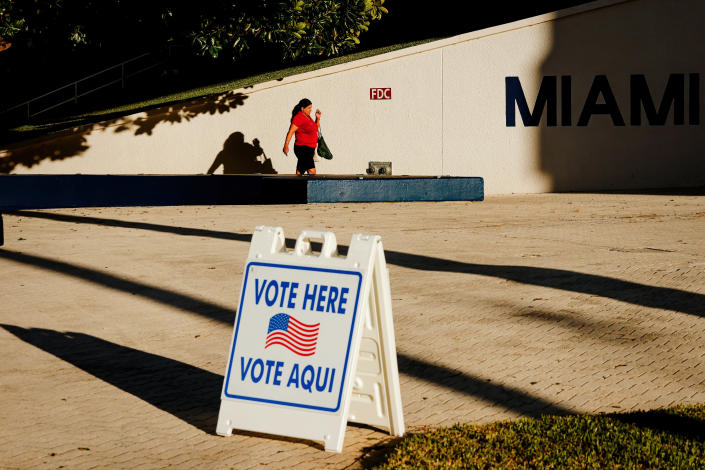 A woman makes her way to a polling place set up at City Hall in Miami Beach, Fla., on Primary Election Day, Aug. 23, 2022. (Scott McIntyre/The New York Times)