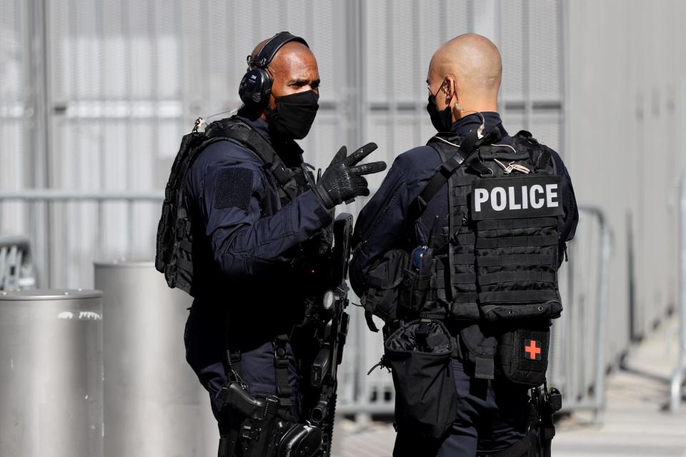 Armed police outside the courtroom (Getty Images)