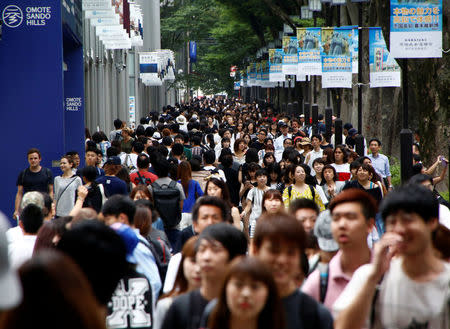 Pedestrians are pictured at a shopping district in Tokyo, Japan August 14, 2017. REUTERS/Kim Kyung-Hoon