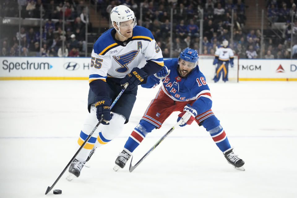 St. Louis Blues defenseman Colton Parayko (55) looks to pass against New York Rangers center Vincent Trocheck (16) in the first period of an NHL hockey game, Monday, Dec. 5, 2022, in New York. (AP Photo/John Minchillo)
