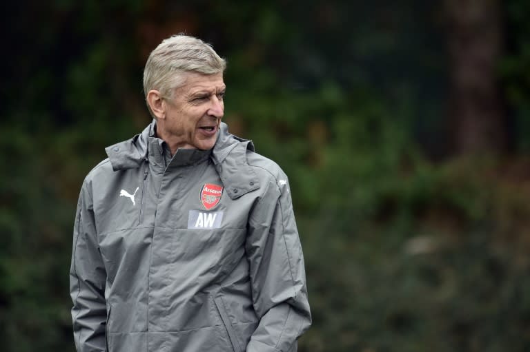 Arsenal's French manager Arsene Wenger attends a training session with his team ahead of their UEFA Champions League Group A match against Basel