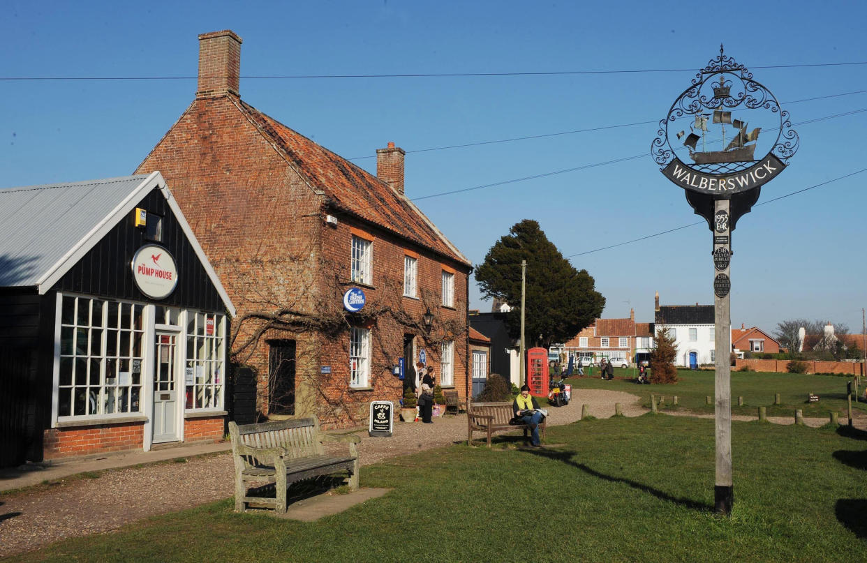 The village green at Walberswick on the Suffolk coast where villagers today formed a human "Save Our Shoreline" (SOS) to protest at the Department for Environment, Food and Rural Affairs' (DEFRA) decision to withdraw funding for the maintenance of its sea defences, a shingle ridge, and floodbanks along its estuary. It is feared this area of outstanding natural beauty will eventually becomed submerged. 