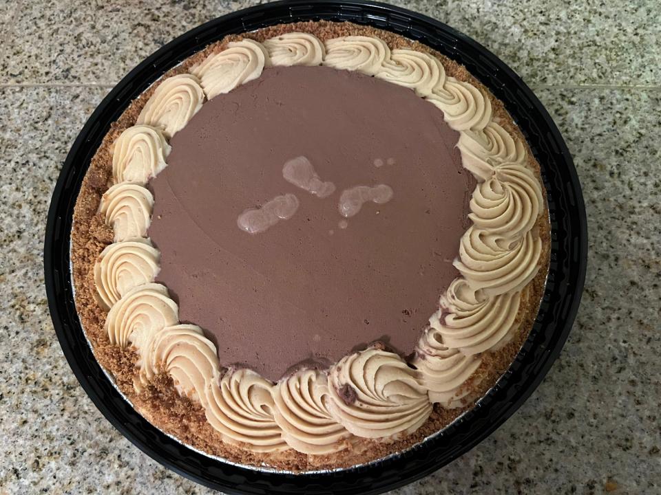 The chocolate-peanut butter pie from Costco in its black plastic packaging on a countertop