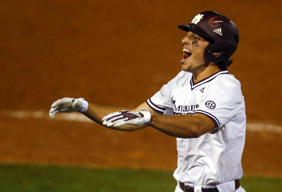 Mississippi State's Marshall Gilbert reacts after a sacrifice bunt to move runners into scoring position during the 10th inning of the Southeastern Conference tournament NCAA college baseball game against LSU, early morning Thursday, May 23, 2019, in Hoover, Ala. (AP Photo/Butch Dill)
