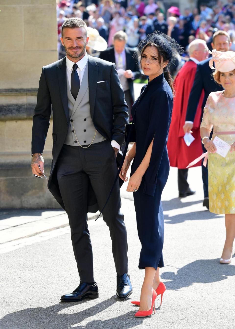 Camera ready: David and Victoria Beckham arrive at St George's Chapel at Windsor Castle before of the Duke and Duchess of Sussex (Getty Images)