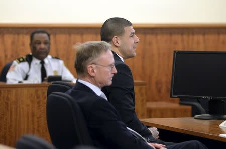 Former New England Patriots football player Aaron Hernandez appears with Defense Attorney Charles Rankin in the court room of the Bristol County Superior Court House in Fall River, Massachusetts, in front of the jury before they begin their deliberations, April 8, 2015. REUTERS/Faith Ninivaggi