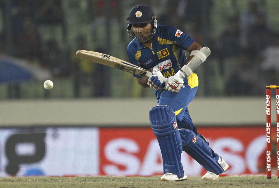 Sri Lankan cricket player Mahela Jayawardene bats during the Asia Cup final cricket match between Sri Lanka and Pakistan in Dhaka, Bangladesh, Saturday, March 8, 2014. (AP Photo/A.M. Ahad)