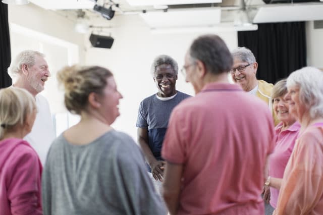 Active seniors talking in circle