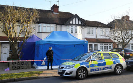 A police officer stands on duty outside the home of Nikolai Glushkov in New Malden, on the outskirts of London, Britain, March 16, 2018. REUTERS/Toby Melville