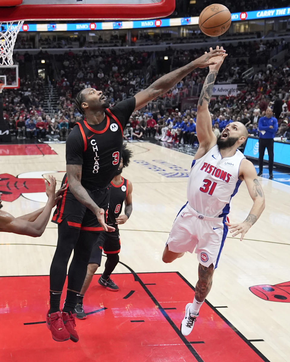 Chicago Bulls' Andre Drummond (3) blocks the shot of Detroit Pistons' Evan Fournier (31) during the first half of an NBA basketball game Tuesday, Feb. 27, 2024, in Chicago. (AP Photo/Charles Rex Arbogast)
