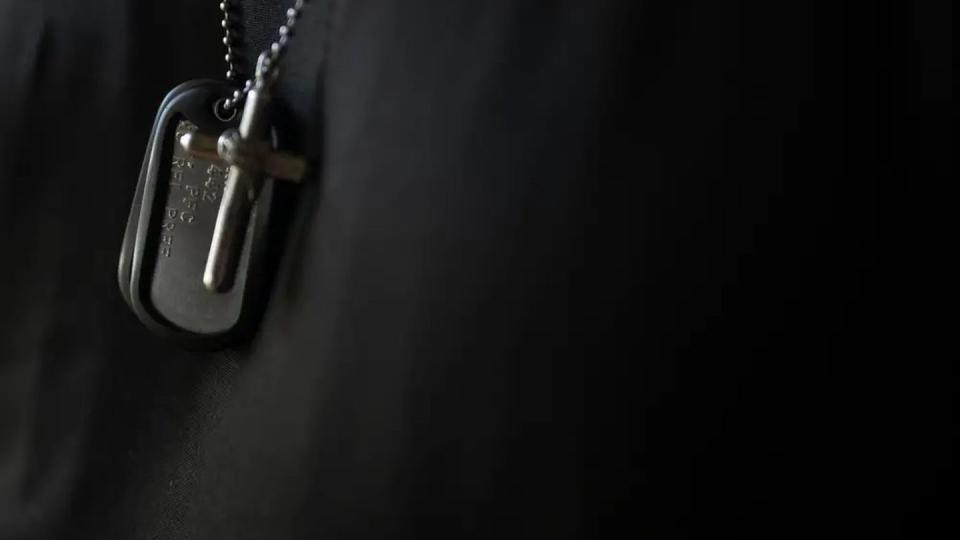 Kenny Castello wears his son’s dog tags and a cross with some of his son’s ashes around his neck. (Rich-Joseph Facun/The Texas Tribune and ProPublica)