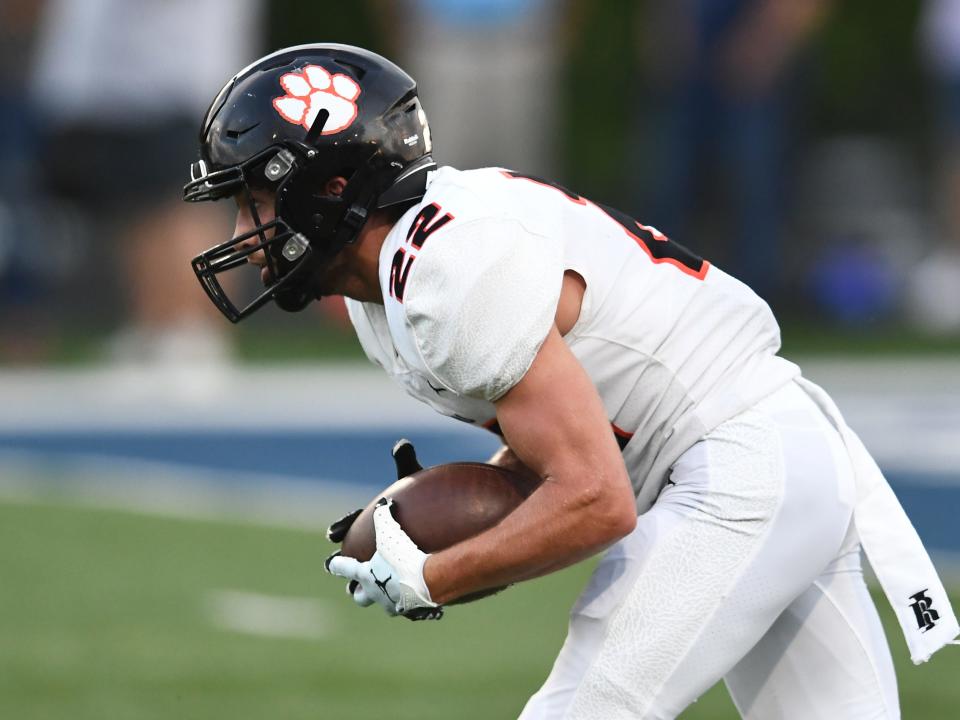 Powell's Gianni Magdos (22) on the kickoff return against Anderson County during a high school football game in Clinton, Tenn. on Friday, August 19, 2022.