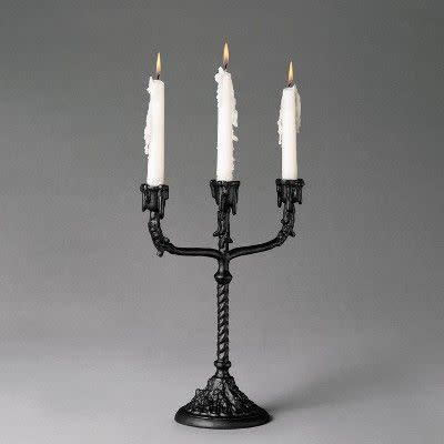 <p><strong>John Derian for Threshold</strong></p><p>target.com</p><p><strong>$20.00</strong></p><p><a href="https://www.target.com/p/12-34-macabre-labra-dripping-candelabra-black-john-derian-for-threshold-8482/-/A-79502750" rel="nofollow noopener" target="_blank" data-ylk="slk:Shop Now;elm:context_link;itc:0;sec:content-canvas" class="link ">Shop Now</a></p><p>A few of these chic “macabre-labras,” with their dripping-wax effect, will be the p op off your <a href="https://www.elledecor.com/life-culture/entertaining/g12031645/halloween-table-decorations/" rel="nofollow noopener" target="_blank" data-ylk="slk:Halloween tablescape;elm:context_link;itc:0;sec:content-canvas" class="link ">Halloween tablescape</a> with </p>