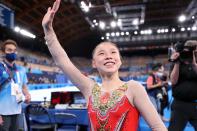 <p>Gold medalist Chenchen Guan of Team China waves to the crowd of athlete spectators after her big win at Ariake Gymnastics Centre on August 3.</p>