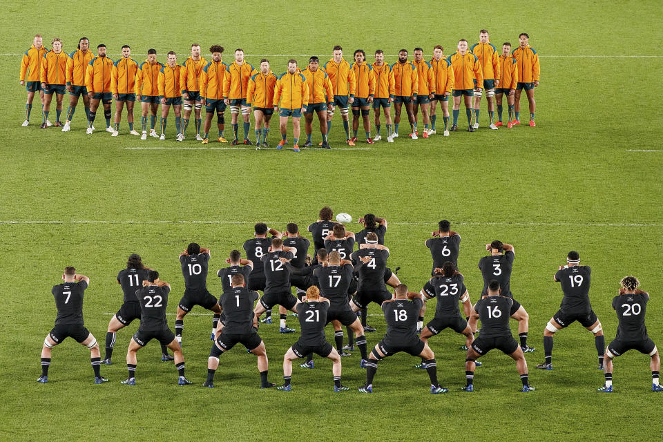 Australian players watch as the All Blacks perform a haka ahead of the Bledisloe Cup rugby test match between the All Blacks and the Wallabies at Eden Park in Auckland, New Zealand, Saturday, Sept. 24, 2022. (David Rowland/Photosport via AP)