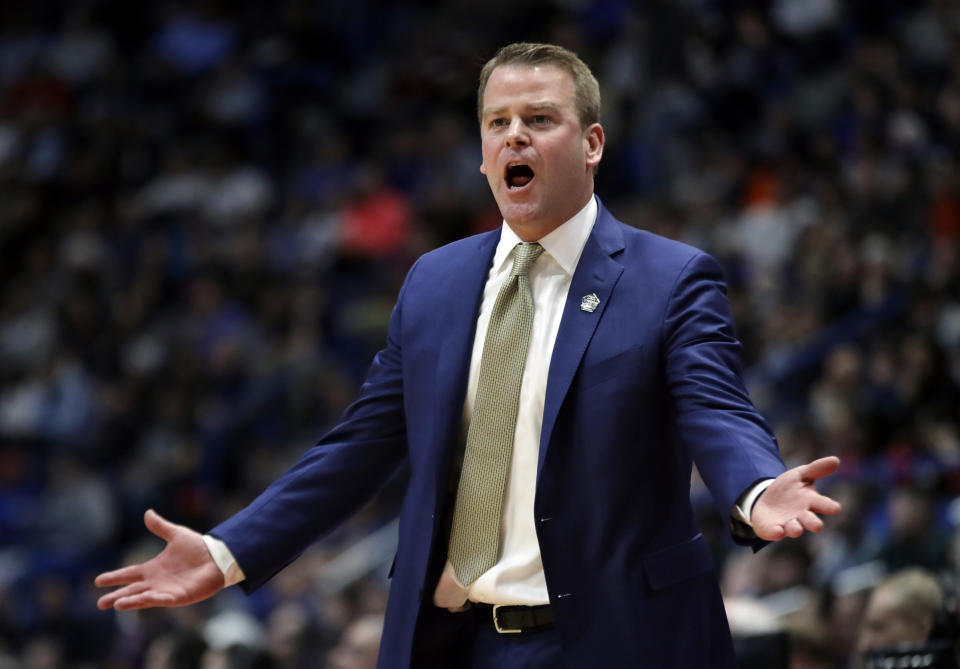 Marquette head coach Steve Wojciechowski complains to the referee during the first half of a first round men's college basketball game against Murray State in the NCAA Tournament, Thursday, March 21, 2019, in Hartford, Conn. (AP Photo/Elise Amendola)